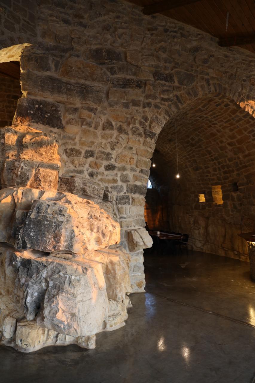 Stone archway into the vaulted room