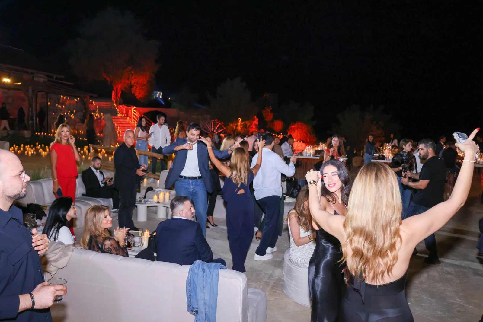 Guests dancing together on the terrace during the 1000M launch celebration