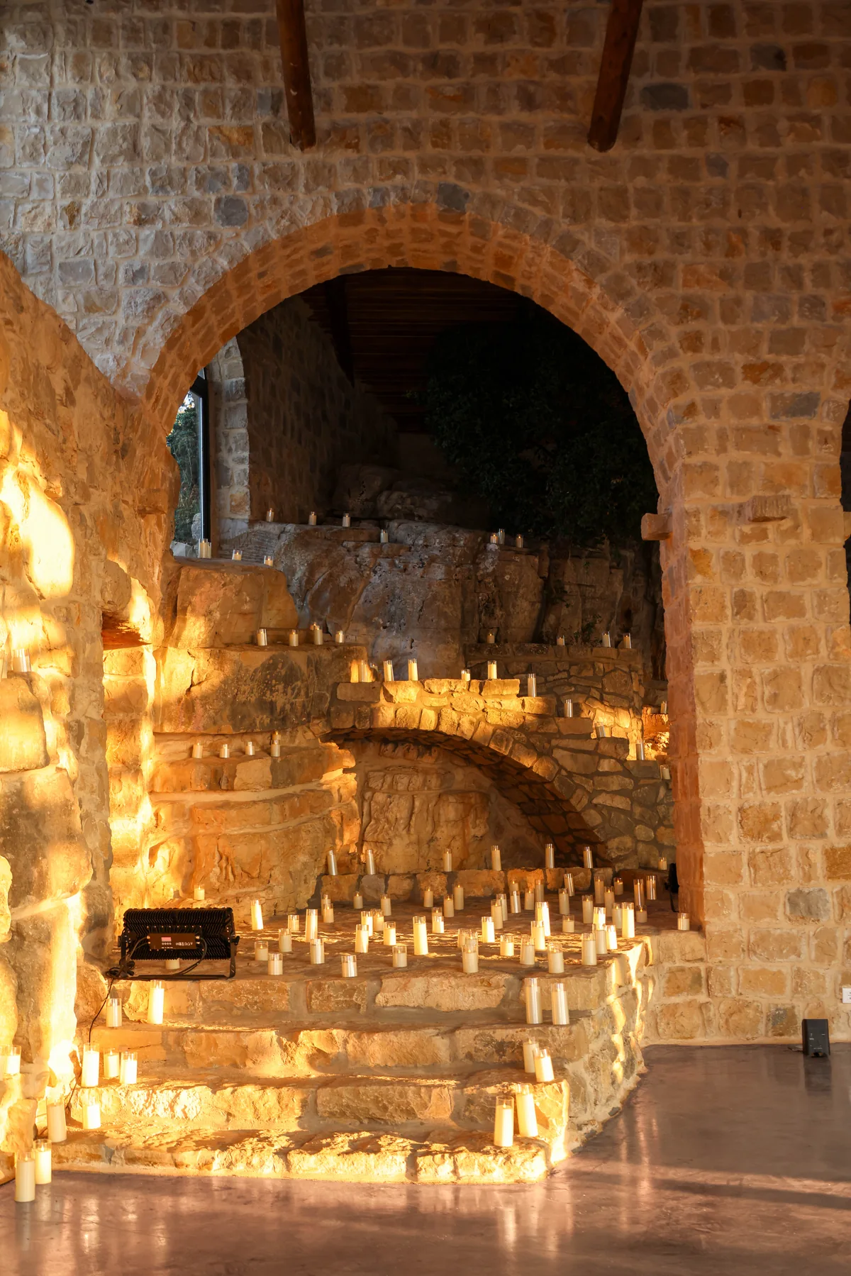 Candles lining the stone staircase to the inside concert stage